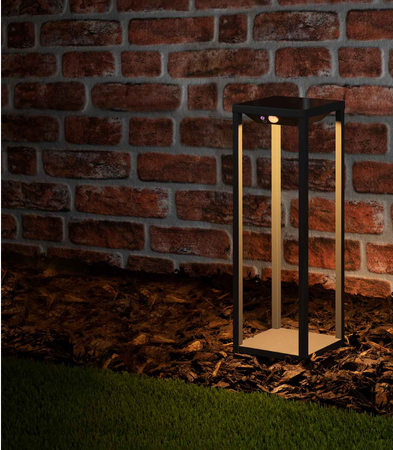 solar light against a brick wall in the garden