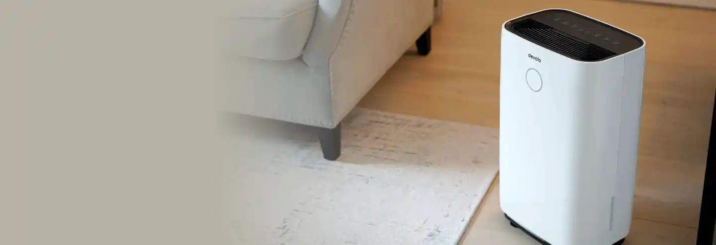 Devola dehumidifier next to a sofa in the lounge