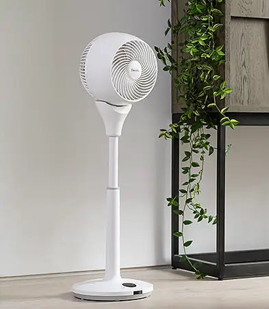 Tall fan in a room with a white background